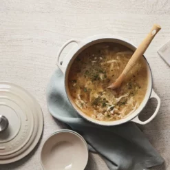 Le Creuset 5.5 Qt. Round Signature Cast Iron Dutch Oven With Stainless Steel Knob | Meringue White 12 Le Creuset 5.5 Qt. Round Signature Cast Iron Dutch Oven With Stainless Steel Knob | Meringue White -Food Prep Tools Shop rs9179 spring 2019 meringuesouprdo 0848